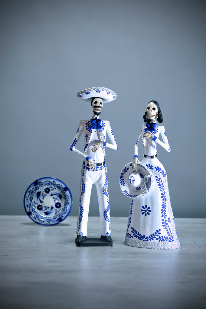 Introducing Catrines Edith and Javier from our Grand Collection.  They both wear a stunning, crisp white Charro suit with intricate hand-painted designs in blue and silver.   The artisan did an outstanding job creating these pieces that add a stylish touch to any home, accurately representing Mexico and its beauty. 