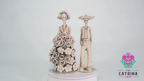 Hand-made clay figurines, Catrines Olga and Jaime are one of our couples made in ivory. All our Catrinas are made in Mexico and we ship worldwide. Add a classy touch of Mexican culture to your home or office.