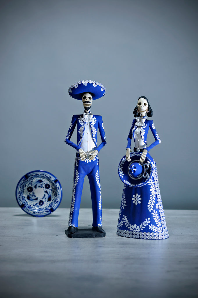 Introducing Catrines Edith and Javier from our Grand Collection.  They are both wearing a stunning blue Charro suit with intricate hand-painted designs in white and silver.   The artisan did an outstanding job creating these pieces that add a stylish touch to any home, accurately representing Mexico and its beauty. 