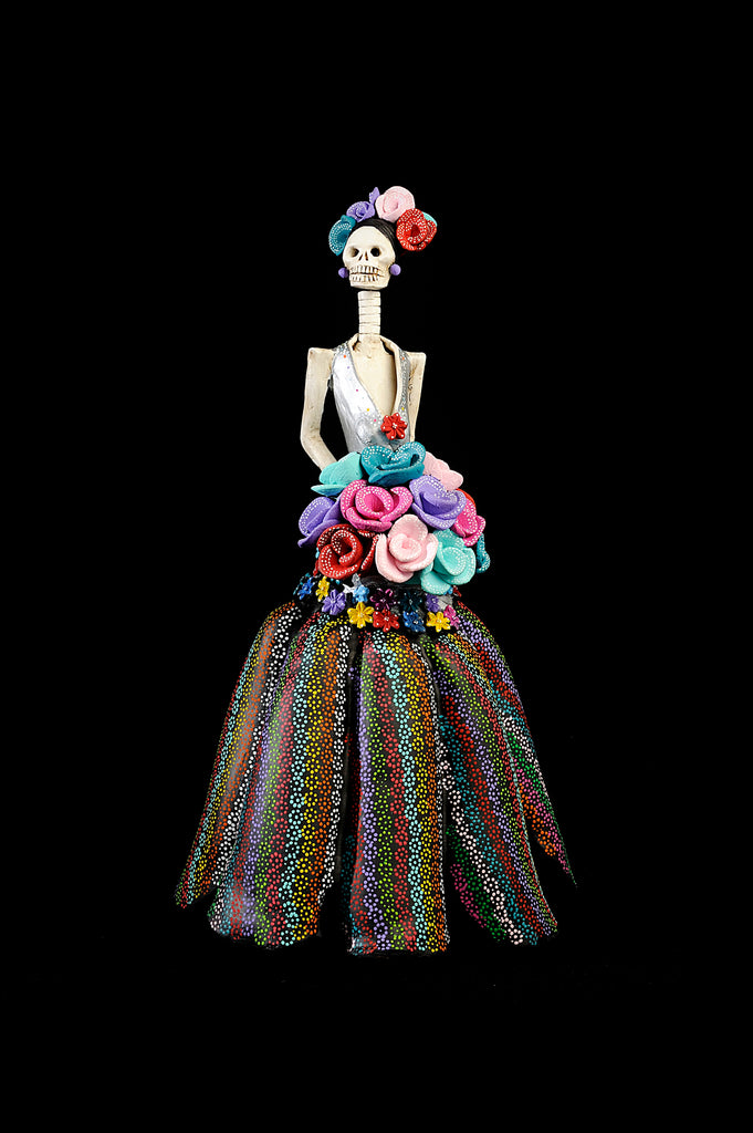 24 inch hand-made clay figurine. Made in Mexico, shipped worldwide. Amelia is wearing a gorgeous plunging v-neckline, with a colorful dotted pattern skirt. Colorful bouquet of roses, colors match her headpiece and the pattern of her dress. Bring a piece of Mexican art home. 