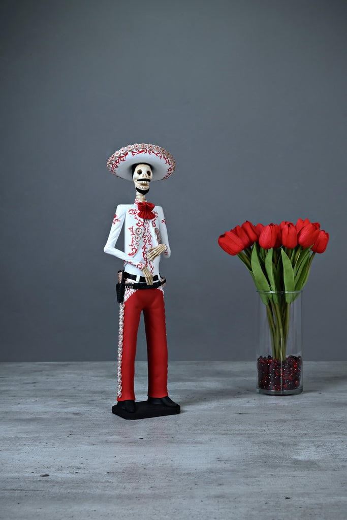 Introducing Catrin Jorge from our Grand Collection.  Jorge is wearing a bright red Charro suit; the Charro Suit first appeared in the 16th century and evolved into an elegant suit made with quality hand-made crafts like the gold buttons and the many intricate hand-painted embroideries in gold.  The artisan did an outstanding job creating this piece that adds a stylish touch to any home and accurately represents Mexico and its beauty.   SAVE 10% WHEN YOU BUY THE COUPLE.