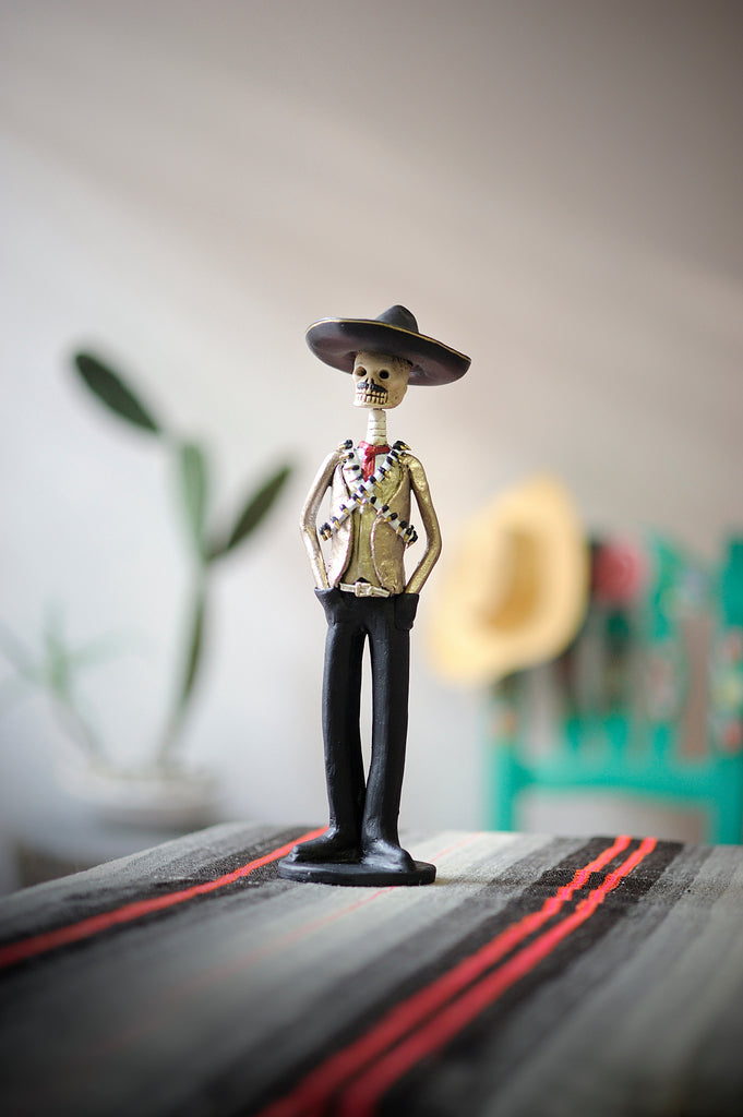 Hand-made clay figurine, Emiliano is one of our famous Catrines, he is wearing a charro hat and our famous bullet belt, all our Catrines and Catrinas are made in Mexico. We ship worldwide, add a classy touch of Mexican culture to your home or office.